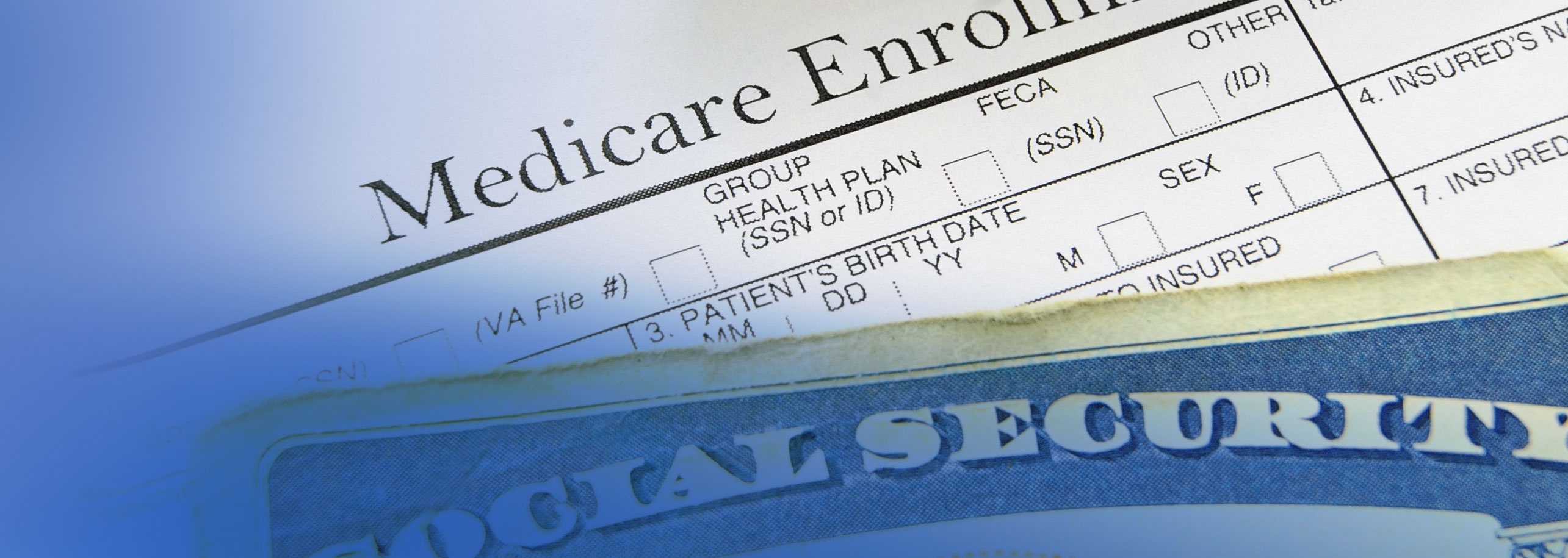 Top portion of social security card on top of Medicare enrollment form