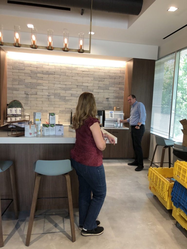 Employees in the kitchen of the Charlotte office